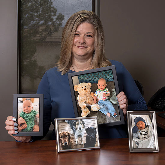 Michelle Boulay with family portraits