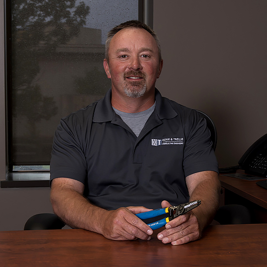 John Coonen holding survey tool