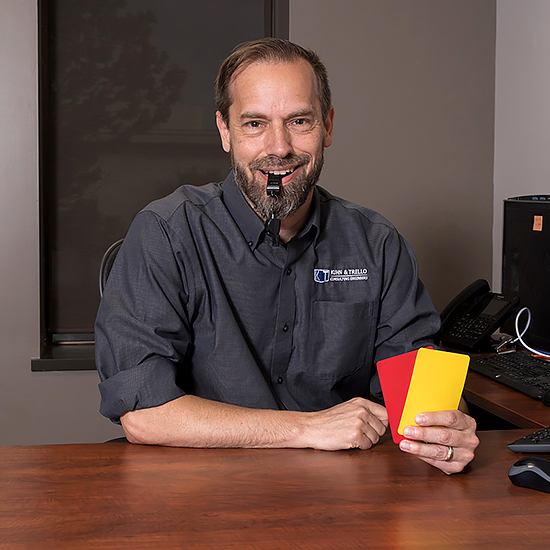 Mike Darling with referee cards and whistle