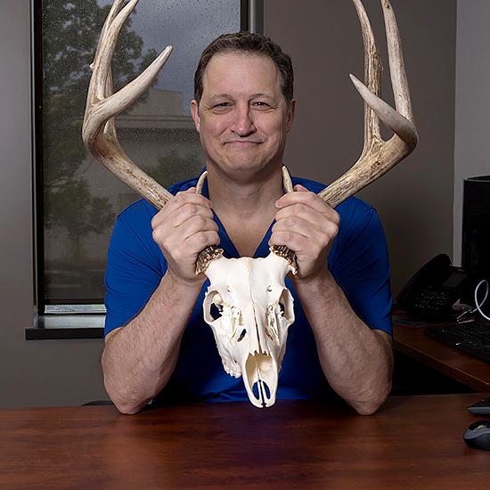 Kevin Kuhn holding antlers