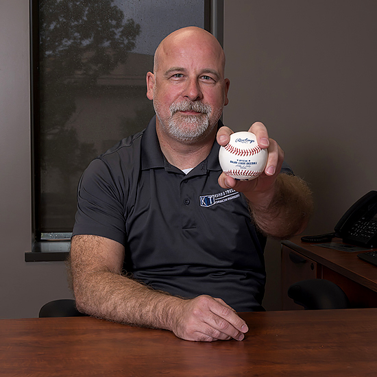 Michael Trello holdiing baseball